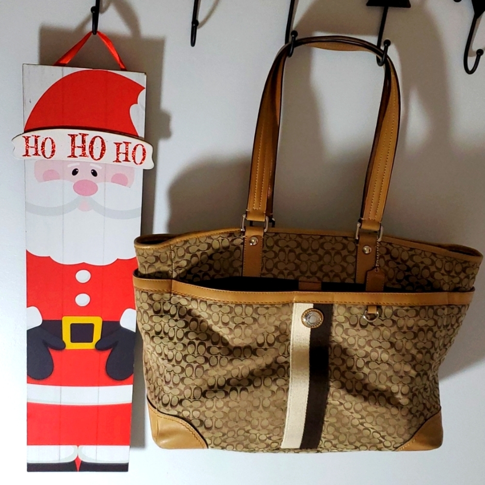 Used Coach diaper bag. Brown and beige. In great condition!